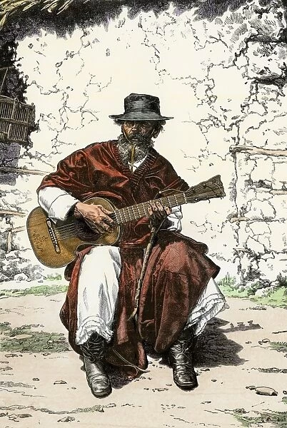 Gaucho playing his guitar, Argentina