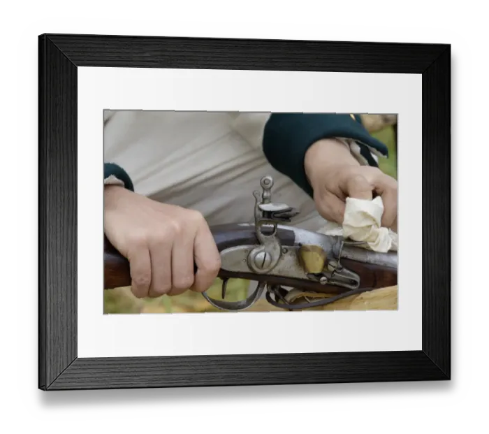 Framed Print : French soldier cleaning his musket at a reenactment on the Yorktown Battlefield Framed Print : French soldier cleaning his musket at a reenactment on the Yorktown Battlefield