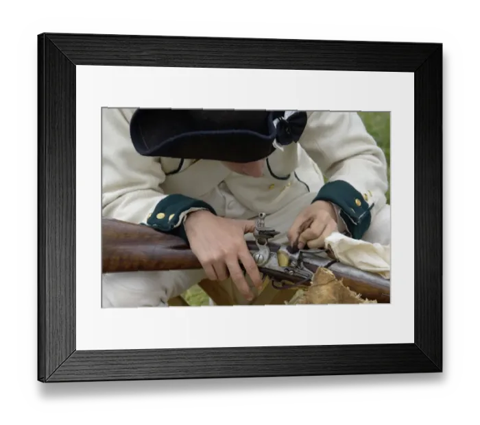 Framed Print : French soldier cleaning his musket at a reenactment on the Yorktown Battlefield Framed Print : French soldier cleaning his musket at a reenactment on the Yorktown Battlefield