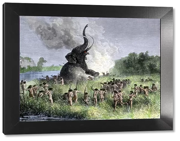 Prehistoric hunters surrounding a wooly mammoth