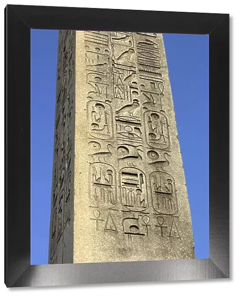 Ancient Egyptian hieroglyphics on an obelisk in Paris