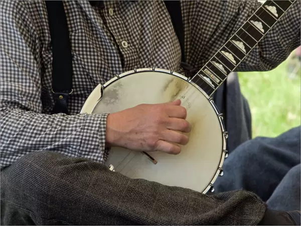 Civil War musician playing a banjo