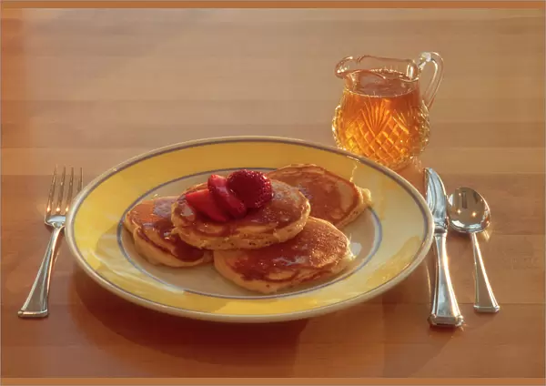 Maple syrup on homemade pancakes
