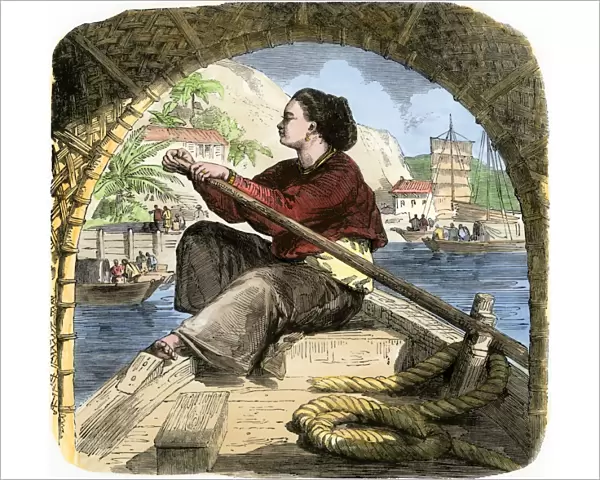 Young woman in Canton rowing a sampan