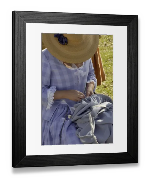 Framed Print : Woman reenactor sewing at Yorktown battlefield