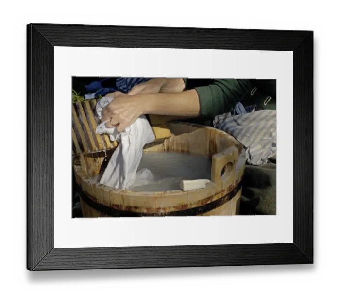 Framed Print : Laundress reenactor demonstrates camp chore at Yorktown battlefield