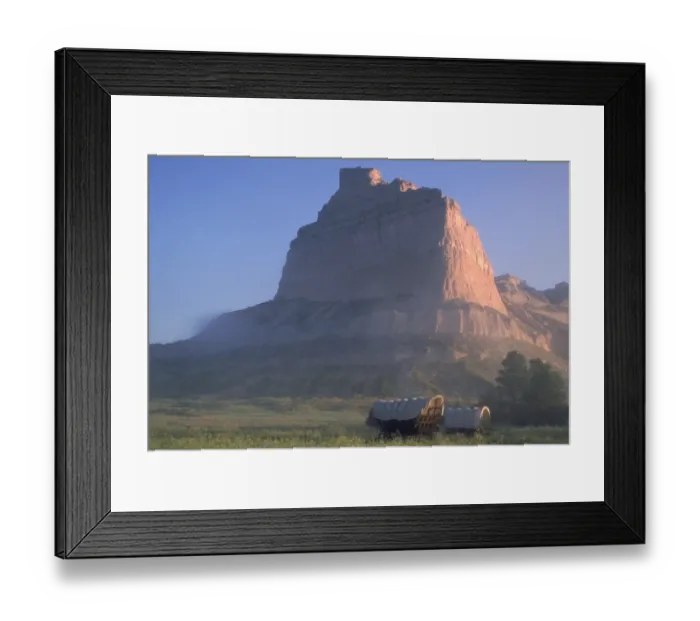 Framed Print : Covered wagons on the Oregon Trail at sunrise Framed Print : Covered wagons on the Oregon Trail at sunrise