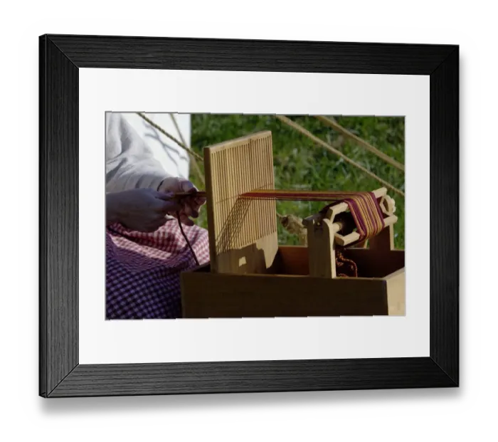 Framed Print : Weaving on a laptop hand-loom Framed Print : Weaving on a laptop hand-loom