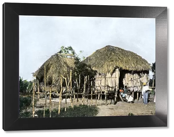 Puerto Rican family and their hut, 1890s