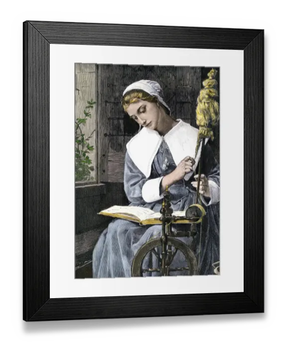 Framed Print : Young Puritan woman reading while spinning at her wheel