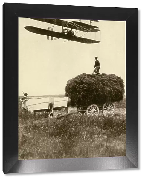 Wright airplane over a French farm