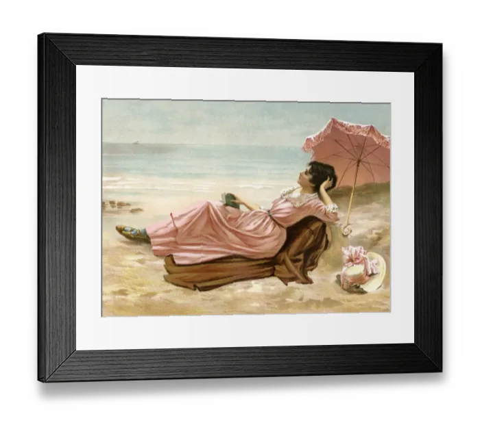 Framed Print : Young woman relaxing on the beach, 1890s Framed Print : Young woman relaxing on the beach, 1890s