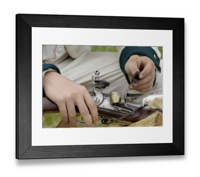 Framed Print : French soldier cleaning his musket at a reenactment on the Yorktown Battlefield Framed Print : French soldier cleaning his musket at a reenactment on the Yorktown Battlefield