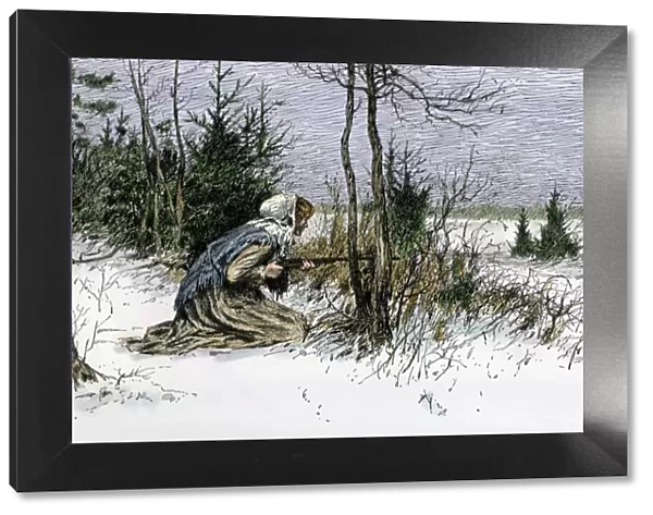 Woman hunting deer in the snow
