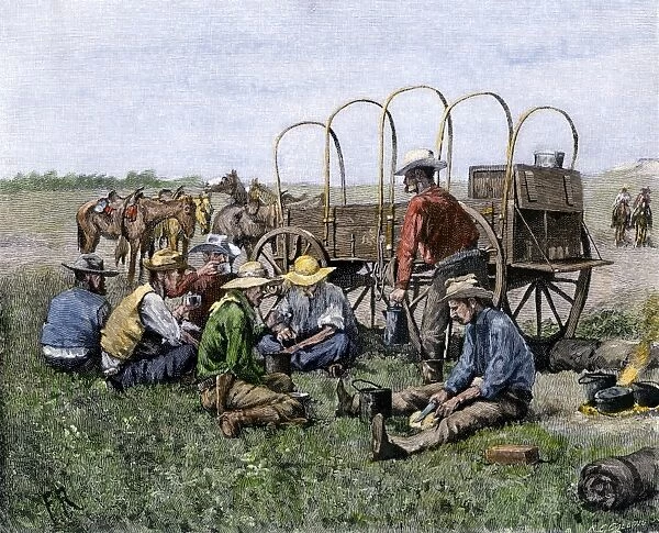 AGRI2A-00074. Chuck wagon serving cowboys their midday meal.
