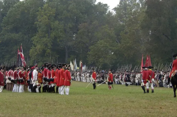 Framed Print : American, French, and British armies on the field in a reenactment of the surrender at Yorktown Battlefield
