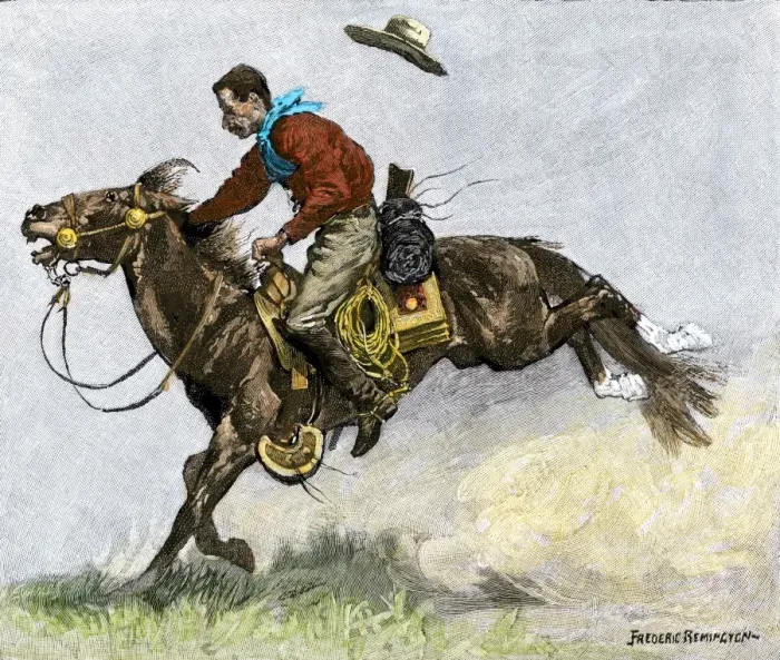 Framed Print : Cowboy riding a newly trained horse Framed Print : Cowboy riding a newly trained horse