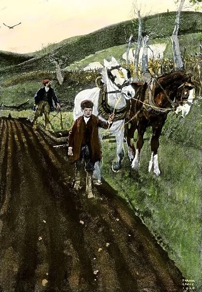 Father and son plowing a field