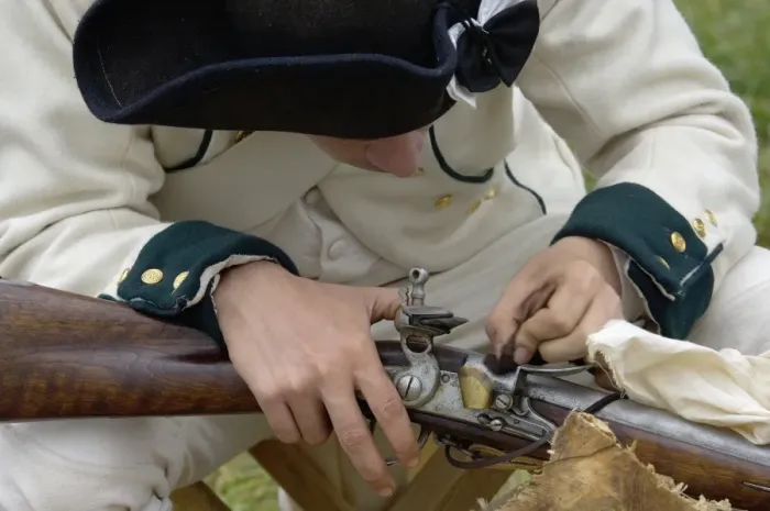 Framed Print : French soldier cleaning his musket at a reenactment on the Yorktown Battlefield Framed Print : French soldier cleaning his musket at a reenactment on the Yorktown Battlefield