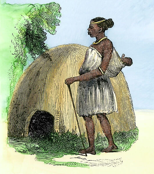 GAFR2A-00051. Zulu mother and child by their hut, Natal, South Africa.