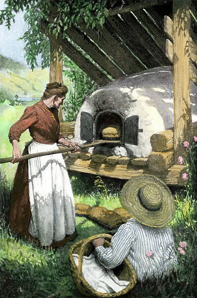 HOUS2A-00141. French-Canadian woman baking bread in an outdoor oven, circa 1900.