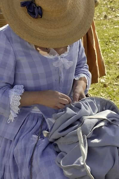 HOUS2D-00063. Woman reenactor sewing at Yorktown battlefield, Virginia.