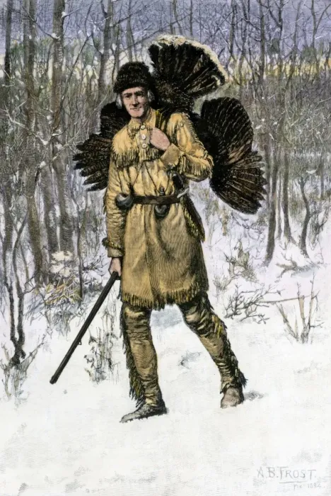Framed Print : Hunter in buckskin carrying a turkey home through the winter woods