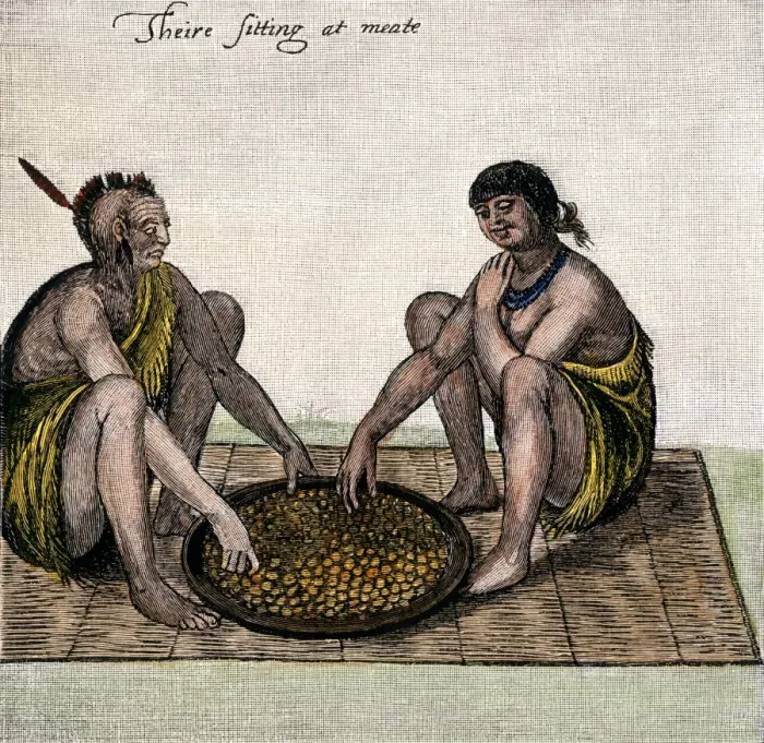 Framed Print : Native American man and woman eating from a basket Framed Print : Native American man and woman eating from a basket