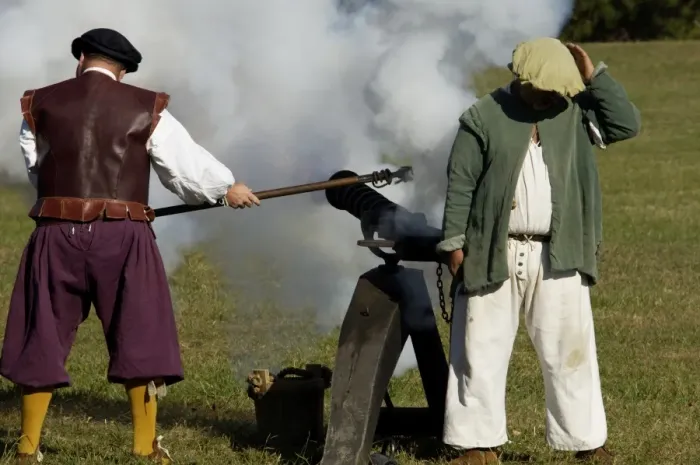 Framed Print : Portuguese swivel gun fired by reenactors