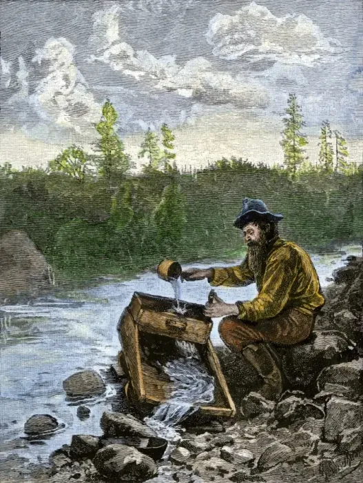 Framed Print : Prospector washing pebbles from a stream using a cradle device to sparate gold Framed Print : Prospector washing pebbles from a stream using a cradle device to sparate gold