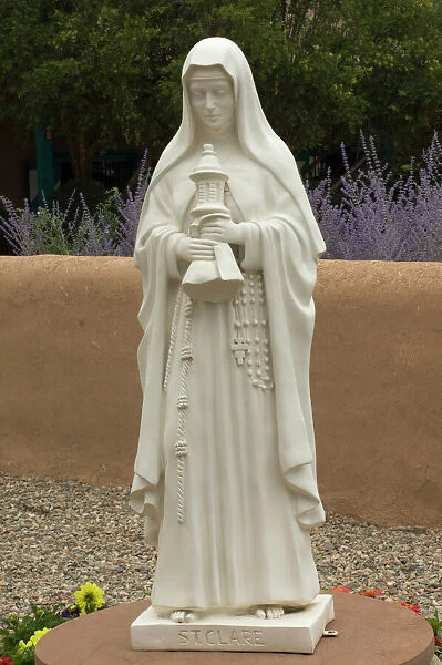 Saint Clare statue, St Francis of Assisi churchyard, Ranchos de Taos, New Mexico.