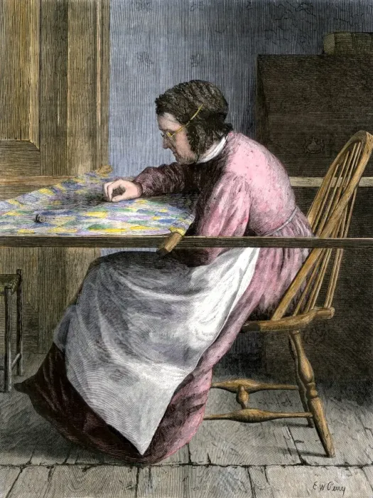 Framed Print : Woman stitching a patchwork quilt, 1800s