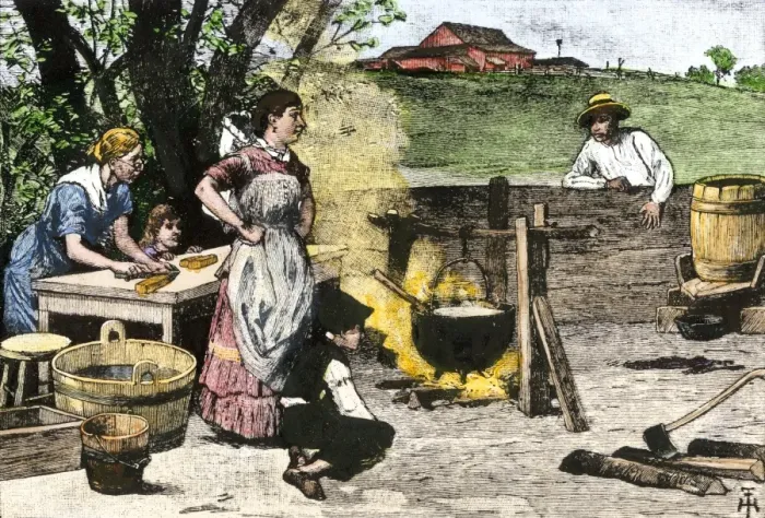 Framed Print : Women rendering lard in a kettle to make soap the old-fashioned way Framed Print : Women rendering lard in a kettle to make soap the old-fashioned way