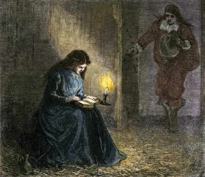Framed Print : Young woman reading the Bible in a Puritan jail Framed Print : Young woman reading the Bible in a Puritan jail