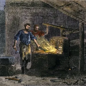 El herrero y su ayudante en un horno forjador. El herrero y su ayudante en un horno forjador.