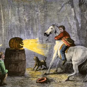 Boys scaring friend with jack-o-lantern Print Boys scaring friend with jack-o-lantern Print