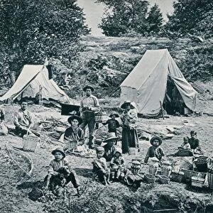 Canadian aboriginals making baskets for sale, 1890s