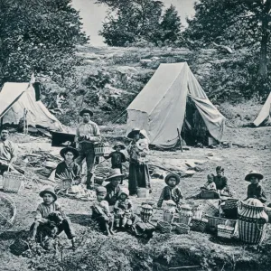 Canadian aboriginals making baskets for sale, 1890s