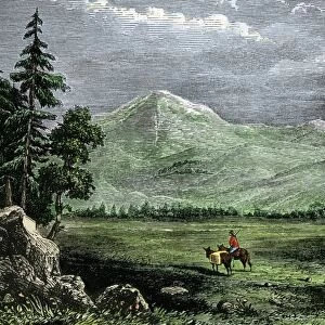 Pioneer with a pack horse in the Rockies