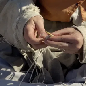 Woman reenactor knitting at Yorktown battlefield Woman reenactor knitting at Yorktown battlefield