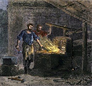 Manual Prints: Blacksmith and his assistant at a forge
