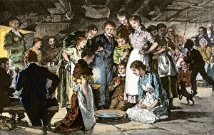 Ireland Prints: Bobbing for apples at a Halloween party in Ireland
