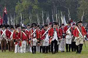 Formation Prints: British army marches onto the field in a reenactment of the surrender