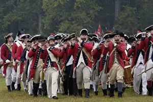 British fife and drum corps takes the field in a reenactment of the surrender