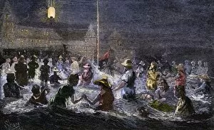 Outdoor Gallery: Coney Island beach lit by electric light, 1880s