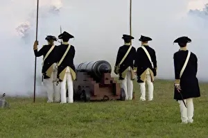 Surrender Prints: Continental Army reenactors firing a cannon at Yorktown battlefield