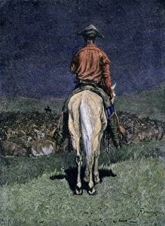 Montana Prints: Cowboy watching over a cattle herd at night