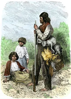 Digger Indians returning from a hunt with rabbits and birds