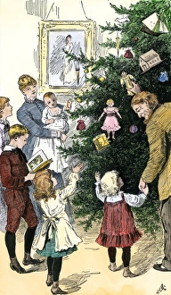 Family admiring their Christmas tree