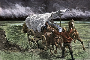 Montana Prints: Family in a covered wagon at the approach of a prairie storm